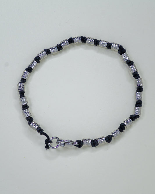 BRACCIALE TUBETTI MARTELLATI E CORDINO