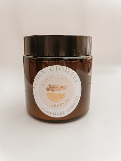CANDELA DI SOIA ARANCIA E CANNELLA CON GIOIELLO DENTRO